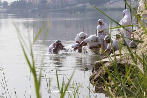 people next to a lake